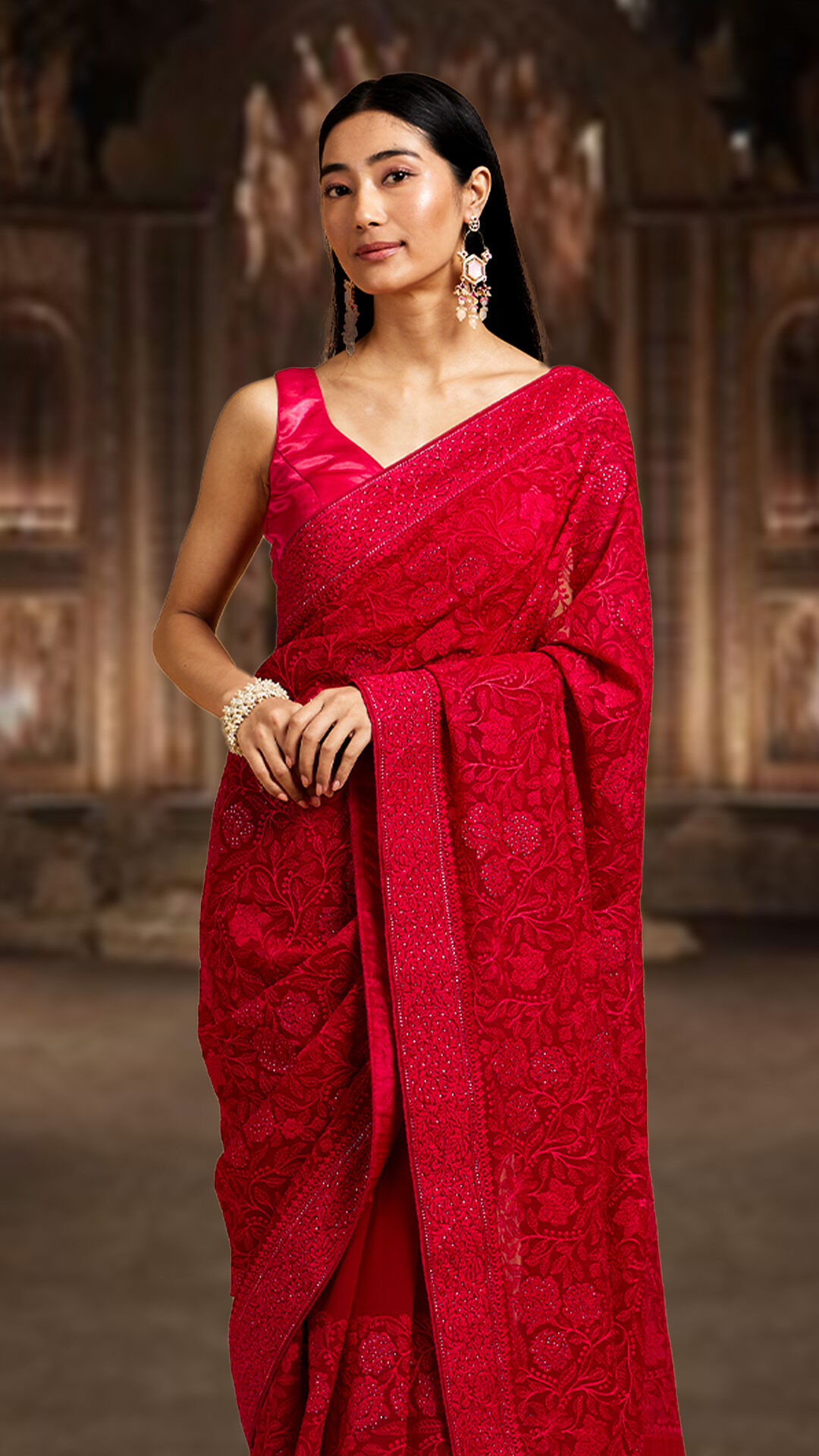 A women wearing elegant dark red saree for wedding